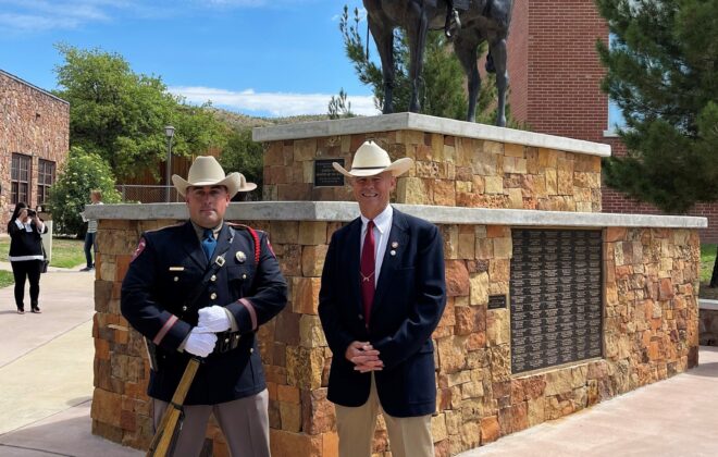 Texas State Trooper Ryan Dalton and Ben H. English stand in front of the Donde Esta? monument on the Sul Ross State University campus in Alpine, TX following the Big Bend Area Law Enforcement Officers Association annual memorial service.