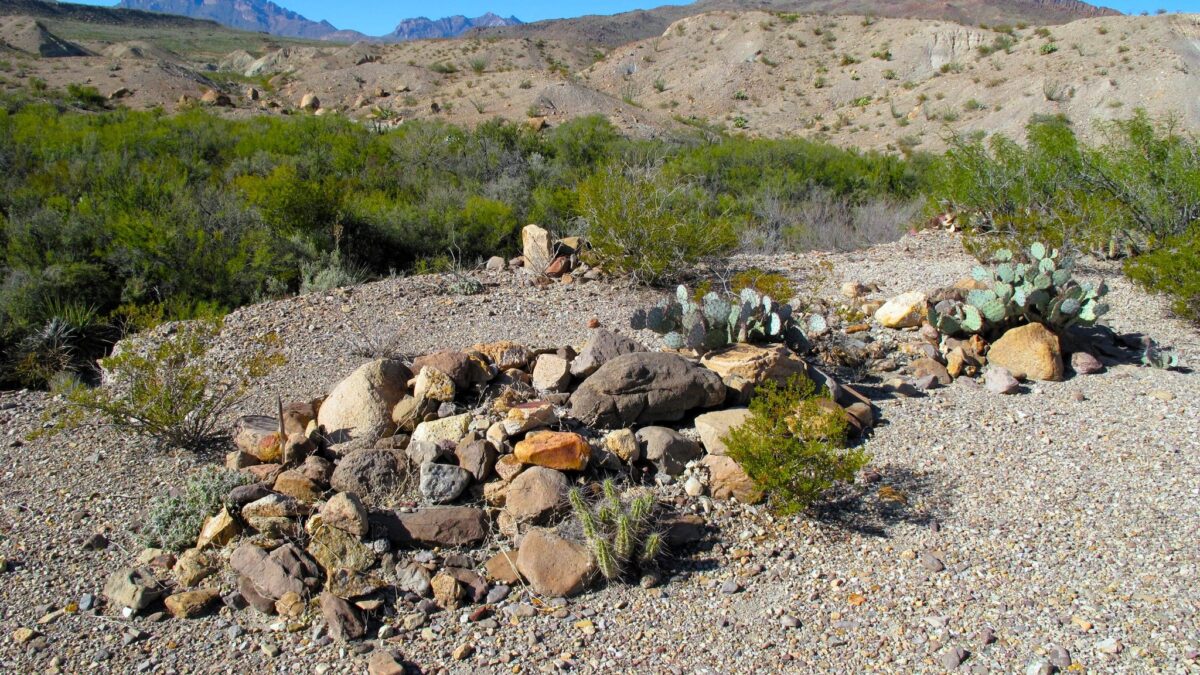 Three remote graves covered in stones in Big Bend National Park.