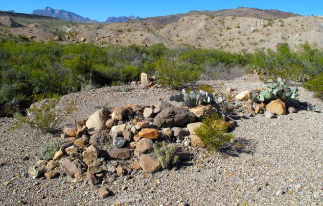 Three remote graves covered in stones in Big Bend National Park.