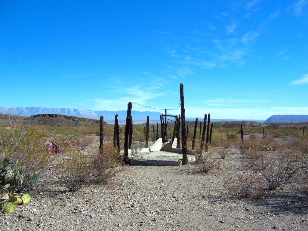 Remote Dipping Vat near Glenn Spring in Big Bend National Park, with distant mountains in the background.